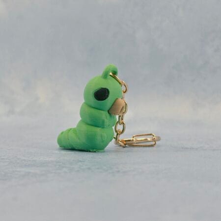 Ainlina Grubs Keychain (Happy or Sad) - Hollow Knight | Keychain Ainlina Grubs Keychain (Happy or Sad) - Hollow Knight | Keychain Keychain inspired by Hollow Knight's grubs ! You can choose the sad or the happy one. 3D printed with multiple colour. January 1st, 2026